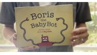 Author Murray Hunter holding his book 'Boris the Babybot' in Cape Town, South Africa, 30 October 2019. Murray Hunter/ Handout via Thomson Reuters Foundation