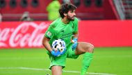 Liverpool's Brazilian goalkeeper Alisson Becker gathers the ball during the 2019 FIFA Club World Cup semi-final football match between Mexico's Monterrey and England's Liverpool at the Khalifa International Stadium in the Qatari capital Doha on December 1