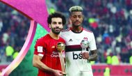 Flamengo’s Bruno Henrique (right) and Liverpool’s Mohamed Salah pose with their awards.
