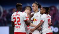 Leipzig's Danish forward Yussuf Poulsen (2nd R) celebrates after scoring the 3-1 lead with Leipzig's French defender Nordi Mukiele (L), Leipzig's German defender Marcel Halstenberg (2nd L) and Leipzig's French midfielder Christopher Nkunku (R) during the 