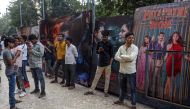 In this photograph taken on December 1, 2019, people wait to enter a cinema in Mumbai.  AFP / Indranil Mukherjee