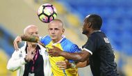 Vladimir Weiss (C) vies for the ball in this file photo