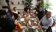 Assyrian Christian family sit together at their house in Tehran, Iran December 24, 2019. Nazanin Tabatabaee/WANA (West Asia News Agency) via Reuters  