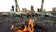 Candle flames burn during a commemoration ceremony for the victims at the scene of the Ethiopian Airlines Flight ET 302 plane crash near the town Bishoftu, March 14, 2019. Reuters / Tiksa Negeri