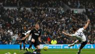 Tottenham Hotspur's English striker Harry Kane (R) scores his team's first goal during the English Premier League football match between Tottenham Hotspur and Brighton and Hove Albion at Tottenham Hotspur Stadium in London, on December 26, 2019.  AFP / To