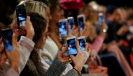 A so-called media influencer takes pictures at Berlin Fashion Week, January 19, 2017. Reuters / Hannibal Hanschke
