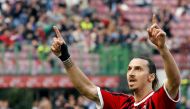 AC Milan's Zlatan Ibrahimovic celebrates after scoring a penalty against Fiorentina during their Italian Serie A soccer match at the San Siro stadium in Milan April 7, 2012. REUTERS/Alessandro Garofalo/File Photo