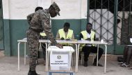 A Guinea-Bissau soldier casts his ballot at a polling station during the second round of the presidential election in Bissau, on December 29, 2019. / AFP / SEYLLOU
