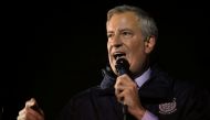 New York City Mayor Bill de Blasio (R) talks during a gathering at Grand Army Plaza in solidarity with the victims after an assailant stabbed five people attending a party at an Hasidic rabbi's home in Monsey, N.Y., on December 28, 2019, while they were c