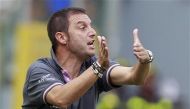 Devis Mangia reacts during a soccer match at the Olympic stadium. Rome. September 25, 2011. REUTERS/Tony Gentile