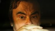 File photo: Carlos Ghosn sits inside a car as he leaves his lawyers office after being released on bail from Tokyo Detention House, March 6, 2019. Reuters / Issei Kato