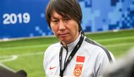 This photo taken on November 6, 2019 shows Li Tie, then head coach of the Chinese national men's football selection team, taking part in a training session in Wuhan in China's central Hubei province./ AFP / STR