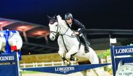 Kamil Sabitov guiding Quintendro over an obstacle during the Medium Tour competition of the Fifth Round of Longines hathab Equestrian Tour, yesterday.