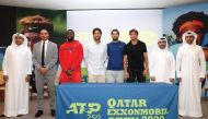 Frances Tiafoe (third left) of USA, Spaniards Fernando Verdasco (fourth left) and Pablo Andujar (fourth right), Malek Jaziri (third right) of Tunisia, players taking part in the Qatar ExxonMobil Open, pose for a picture with Tariq Zainal (second right), S