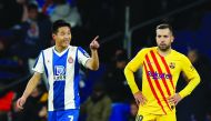 Espanyol's Wu Lei celebrates scoring their second goal as Barcelona's Jordi Alba looks dejected. (La Liga Santander, Espanyol v FC Barcelona, RCDE Stadium, Barcelona, Spain, January 4, 2020.)    Reuters/Albert Gea