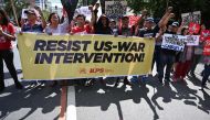 Protesters take part in a rally in front of the US embassy in Manila on January 6, 2020, demonstrating against the US strike that killed Iranian commander Qasem Soleimani in Iraq. AFP / Ted Aljibe 