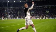 Juventus' Portuguese forward Cristiano Ronaldo celebrates after scoring his third goal during the Italian Serie A football match Juventus vs Cagliari on January 6, 2020 at the Juventus Allianz stadium in Turin. / AFP / Marco BERTORELLO