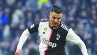 Juventus' Portuguese forward Cristiano Ronaldo outruns Cagliari's Uruguayan midfielder Nahitan Nandez (Bottom) during the Italian Serie A football match Juventus vs Cagliari on January 6, 2020 at the Juventus Allianz stadium in Turin. AFP / Marco Bertorel