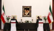 Men sign condolence books for the victims of the Ukraine International Airlines crash in Iran and for Iranian Major-General Qassem Soleimani, who was killed in an airstrike near Baghdad, at the Iranian embassy in Minsk, Belarus January 10, 2020. Reuters/V