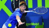 Corentin Moutet of France returns the ball to Stan Wawrinka of Switzerland during their semi-final match of Qatar ExxonMobil Open 2020 at the Khalifa International Tennis and Squash Complex in Doha yesterday. Corentin Moutet won the match and will take on