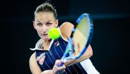 Karolina Pliskova of the Czech Republic hits a return to Naomi Osaka of Japan during the women's Semi Final match in the Brisbane International tennis tournament in Brisbane on January 11, 2020. AFP / AFP / Patrick Hamilton  