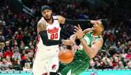 Milwaukee Bucks power forward Giannis Antetokounmpo (34) is fouled by Portland Trail Blazers power forward Carmelo Anthony (left) while driving to the basket during the first half at Moda Center, Jan 11, 2020; Portland, Oregon. Credit: Soobum Im-USA TODAY