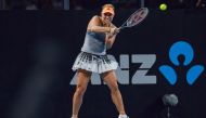 Angelique Kerber of Germany hits a return against Wang Qiang of China during their women's first round singles match at the Adelaide International tennis tournament in Adelaide on January 13, 2020. (AFP / Brenton EDWARDS )