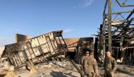 U.S. soldiers are seen at the site where an Iranian missile hit at Ain al-Asad air base in Anbar province, Iraq January 13, 2020. REUTERS/John Davison 