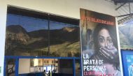 A mural outside a bus station warns of the dangers of human trafficking, Calca, Peru. December 1, 2019. Thomson Reuters Foundation/Anastasia Moloney