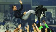 Al Sadd coach Xavi Hernandez is thrown into the air by his players as they celebrate winning the Qatar Cup final against Al Duhail at the Jassim Bin Hamad Stadium on Friday.