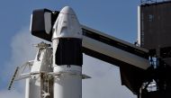 The SpaceX Crew Dragon capsule sits atop a Falcon 9 booster rocket on Pad 39A at Kennedy Space Center after a scheduled in-flight abort test was postponed due to poor weather offshore at Cape Canaveral, Florida, U.S. January 18, 2020. REUTERS/Steve Nesius