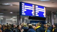 Relatives and colleagues during a tribute ceremony for the 11 Ukrainians who died in a plane mistakenly shot down by Iran during a spike in tensions with Washington, at Kiev's Boryspil airport, on January 19, 2020. 