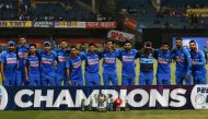 India's cricketers pose for a team photograph with the trophy after winning the third and last one day international (ODI) cricket match of a three-match series between India and Australia at the M. Chinnaswamy Stadium in Bangalore on January 19, 2020. / 