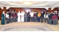 QIIB’s Chief Executive Officer, Dr. Abdulbasit Ahmed Al Shaibei, and other officials with the students.