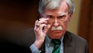 John Bolton adjusts his glasses as Donald Trump speaks while meeting with NATO Secretary General Jens Stoltenberg in the Oval Office, April 2, 2019. Reuters / Joshua Roberts