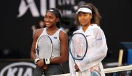 Japan's Naomi Osaka (R) and Coco Gauff of the US pose for a photo prior to their women's singles match on day five of the Australian Open tennis tournament in Melbourne on January 24, 2020. / AFP / DAVID GRAY /