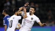 Al Sadd's Baghdad Bounedjah (right) and Hassan Al Haydos celebrate a goal against Al Shahania during their QNB Stars League game yesterday.  