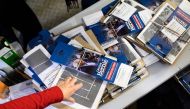 A volunteer points to canvassing materials at the Bernie Sanders presidential campaign field office in Cedar Rapids, Iowa on January 25, 2020. AFP / Stephen Maturen  