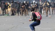 Iraqi protesters clash with riot police following an anti-government demonstration in al-Khilani Square in Baghdad on January 26, 2020. AFP / Ahmad Al-Rubaye
 