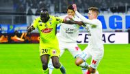 Angers forward Sada Thioub (left) vies with Marseille defender Valentin Rongier during the French L1 football match  at the Velodrome Stadium in Marseille, southern France on Saturday.