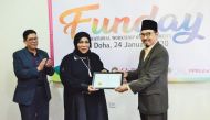 Ambassador of the Republic of Indonesia to Qatar, H E M Basri Sidehabi, honouring one of the guests during the educational workshop on Alzheimer’s.