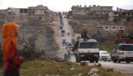 Syrians drive with their belongings through the town of Ariha in the northern countryside of Syria's Idlib province on January 27, 2020, as people flee from the south of Idlib amidst an ongoing government forces' offensive. (AFP / AAREF WATAD)