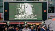 Mourners gather in Microsoft Square near the Staples Center to pay respects to Kobe Bryant after a helicopter crash killed the retired basketball star, in Los Angeles, California, U.S., January 28, 2020. Reuters/Kyle Grillot