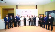 H E Ahmad Al Sayed (centre), Minister of State and Chairman of Qatar Free Zones Authority, and DHL officials during the event.