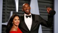 FILE PHOTO: 2018 Vanity Fair Oscar Party - Arrivals - Beverly Hills, California, U.S., 04/03/2018 - Kobe Bryant holds his Oscar for Best Animated Short, with wife Vanessa. REUTERS/Danny Moloshok/File Photo