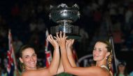Hungary's Timea Babos (L) and France's Kristina Mladenovic (R) pose with the championship trophy during the awards ceremony after their victory against Taiwan's Hsieh Su-wei and Czech Republic's Barbora Strycova during the women's doubles final on day twe