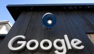 FILE PHOTO: In this file photo taken on January 20, 2020 a Google logo is seen on the brand's stand ahead of the annual meeting of the World Economic Forum (WEF) in Davos.  AFP / Fabrice COFFRINI