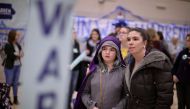 Supporters of Democratic presidential candidate Sen. Elizabeth Warren (D-MA) prepare to caucus for her in the gymnasium at Roosevelt High School February 03, 2020 in Des Moines, Iowa. Chip Somodevilla/Getty Images/AFP