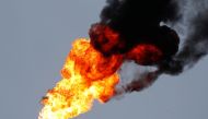 A flame burning natural gas is seen at the Joint stock company Mozyr oil refinery near the town of Mozyr, Belarus, January 4, 2020. Reuters / Vasily Fedosenko