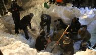 Search and rescue works continue at site to find a construction equipment and a van, which have been buried under avalanche with passengers, at Van-Bahcesaray highway in Van, Turkey on February 4, 2020. (Özkan Bilgin / Anadolu Agency)
 